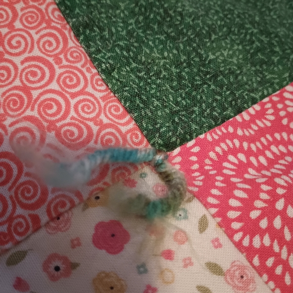 Beautiful pink backing quilt with yarn ties. - Picture 10 of 16